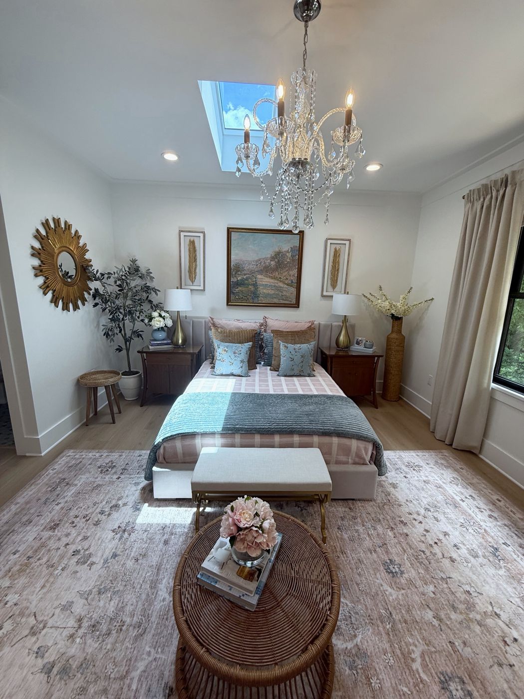 Bedroom with crystal chandelier and skylight