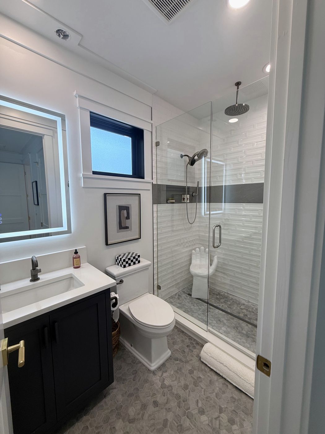 Bathroom with glass shower and rain head
